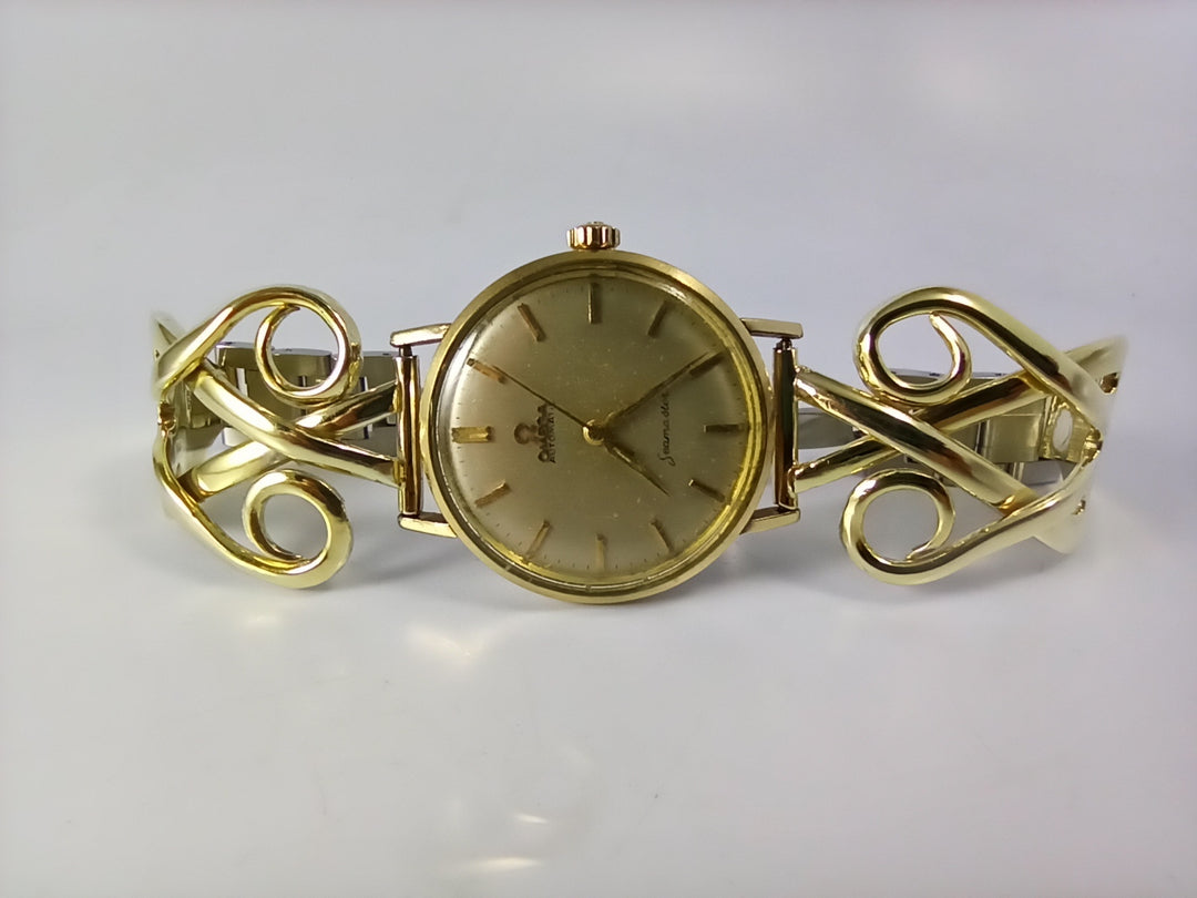 Silver fork watch band, gold jewelry
