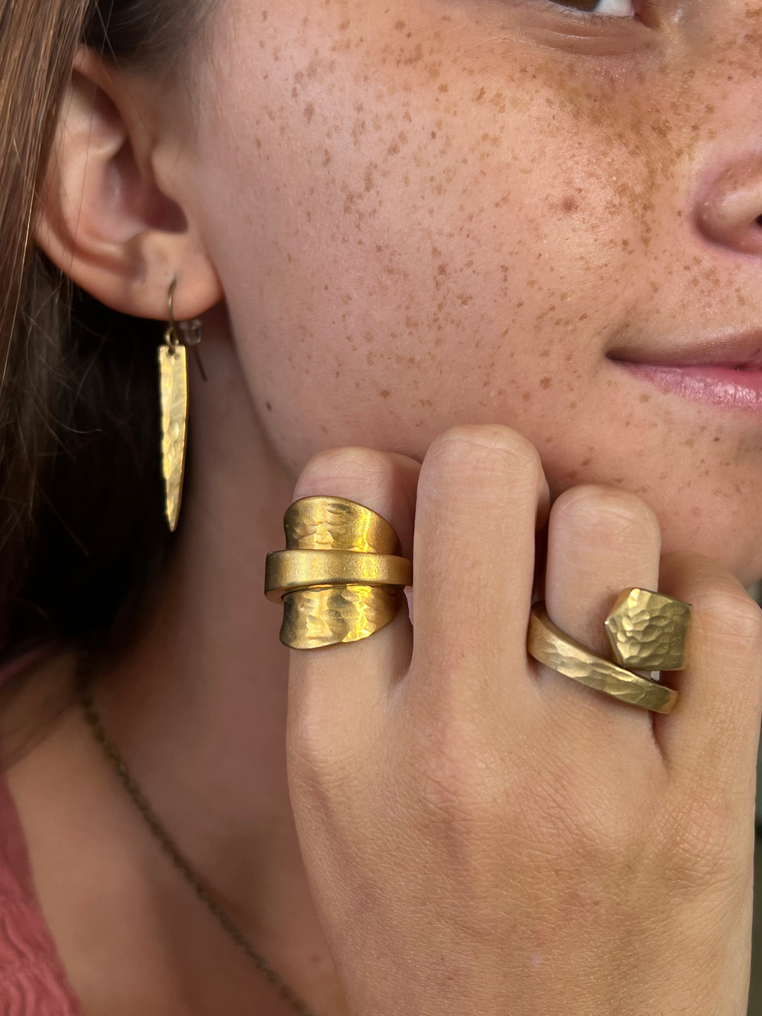 Model wearing spoon rings and fork earrings