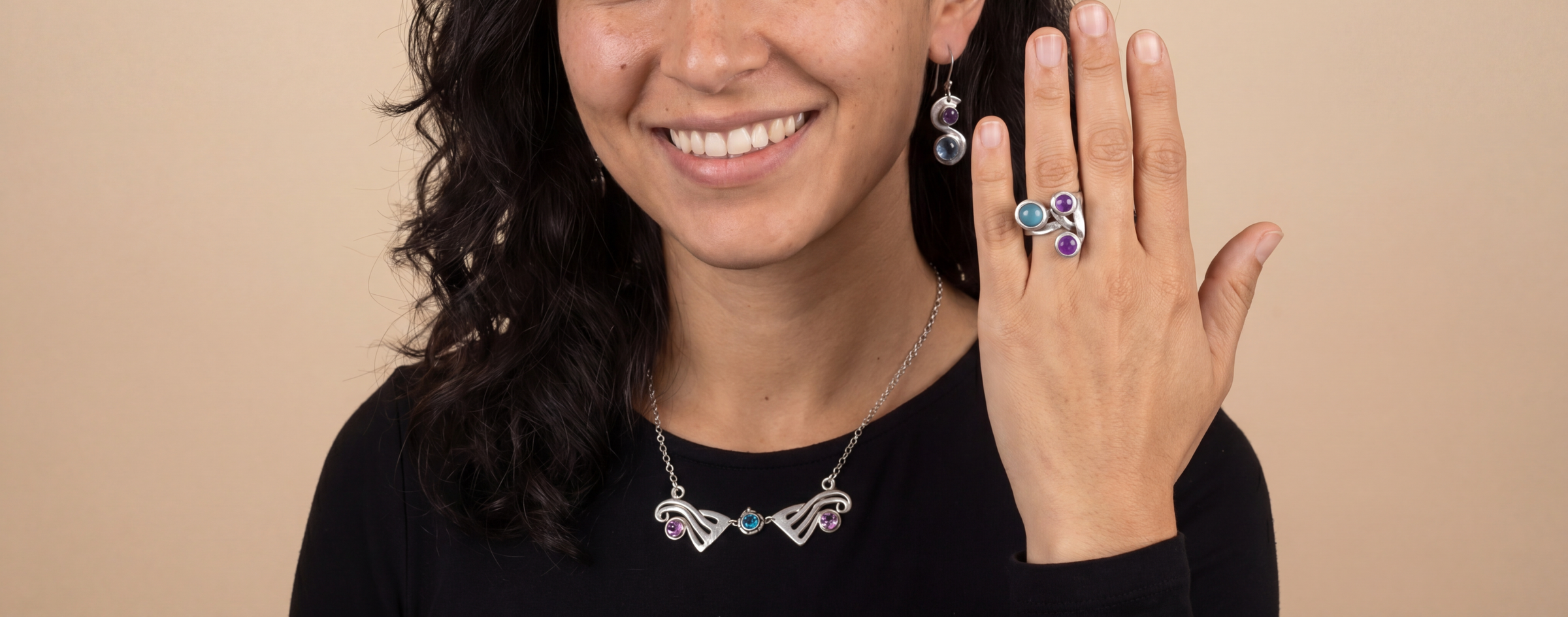 Gemstone silverware jewelry ring, necklace & earrings, worn by a female model
