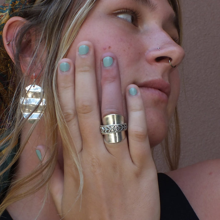 Pierced spoon ring on model's hand